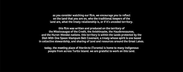 A detailed cinematic land acknowledgment is displayed in white san serif letters against a black screen.